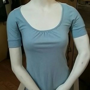 Light teal open back tee shirt